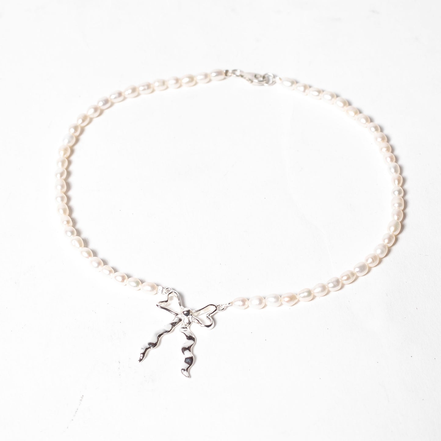 Small Silver bow with Freshwater Pearl chain Necklace